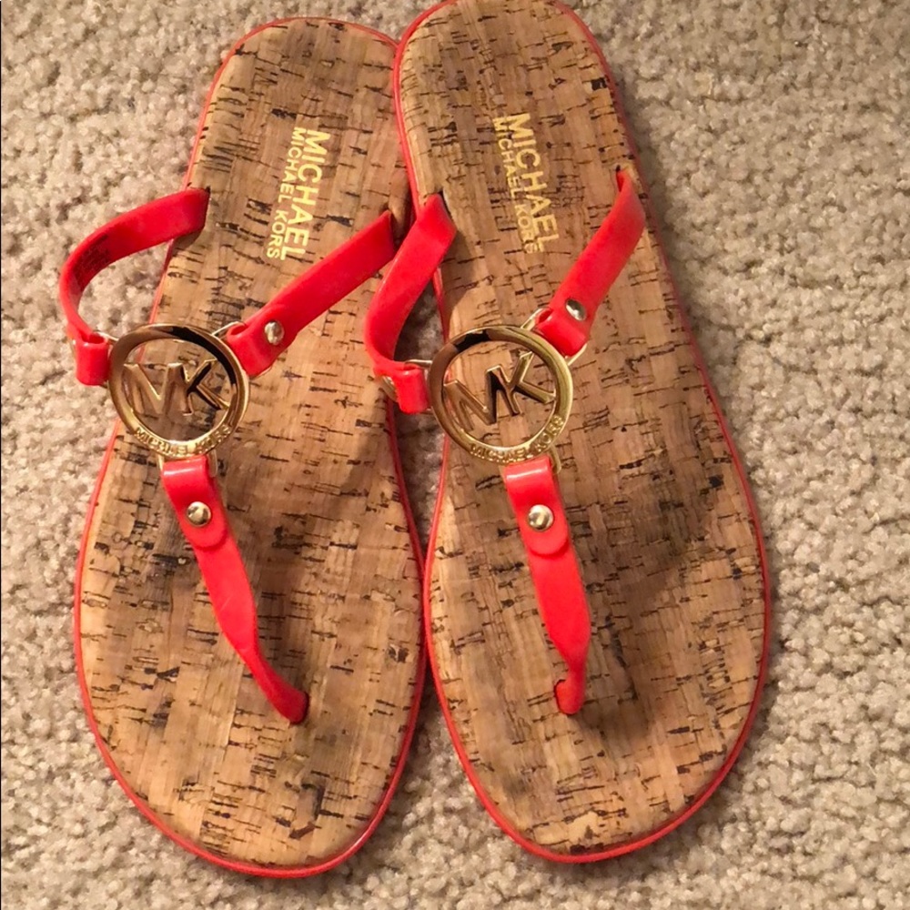 Orange MK flip flops
